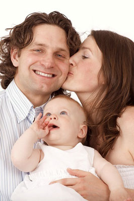 Happy Couple With Baby